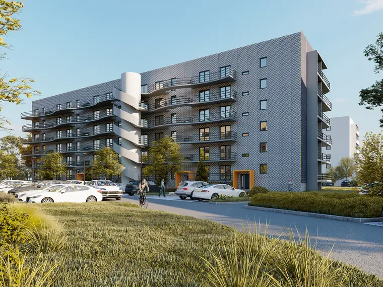 Langgestreckter Plattenbau mit neuer Fassade und Balkonen in Mülsen