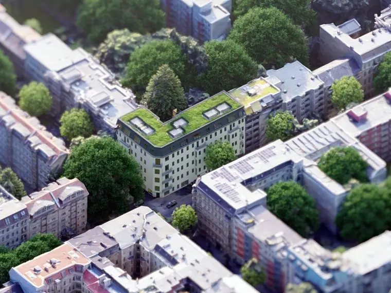 Luftbild eines Berliner Blocks mit begrüntem Dach und neu ausgebautem Dachgeschoss